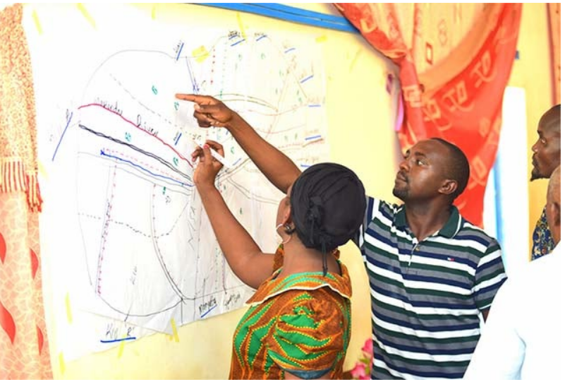 Community members reviewing development plans